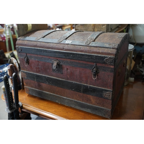 820 - An antique dome topped trunk, measuring 77x53x45cm.