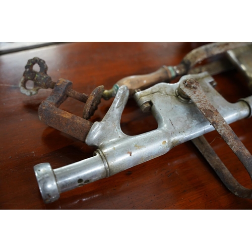 826 - Two vintage bar mounted corkscrews.