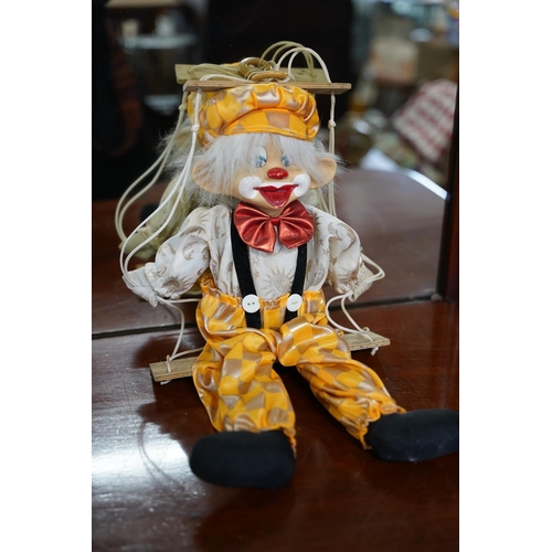 837 - A porcelain faced clown.