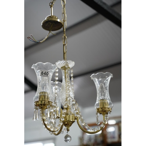 840 - A stunning brass and glass droplet three branch centre light.