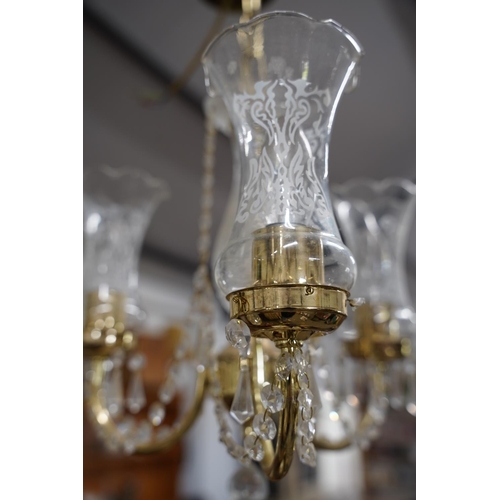 840 - A stunning brass and glass droplet three branch centre light.