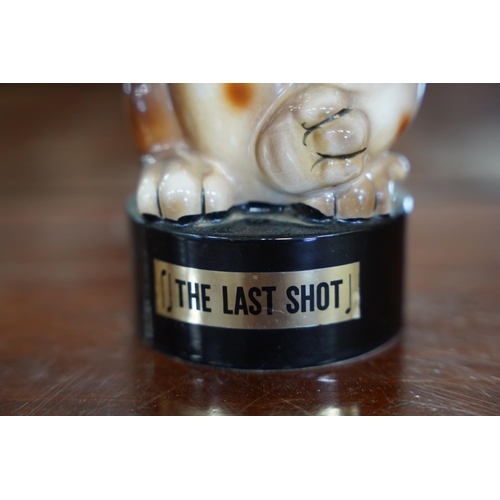 855 - A stunning vintage 'The Last Shot' ceramic musical decanter.