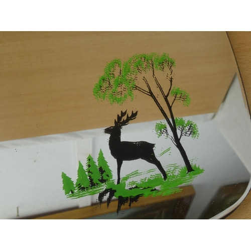 920 - A vintage mirror and hand painted detail of a forest and deer scene, measuring 50x34cm.