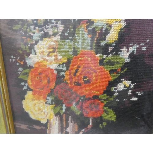 998 - A gilt framed tapestry panel of flowers, measuring 42x60cm.