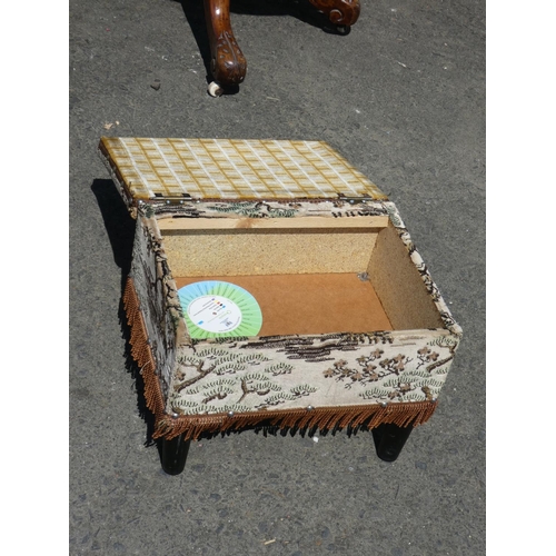 1025 - A small upholstered lidded footstool.