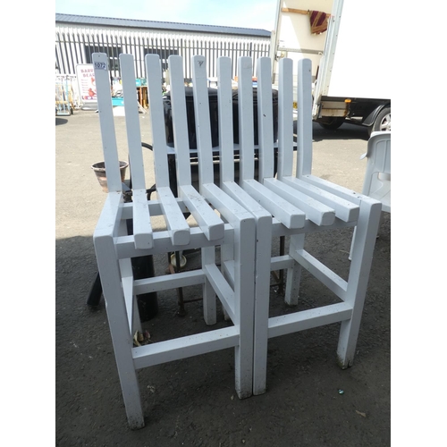 1072 - A pair of wooden garden chairs.