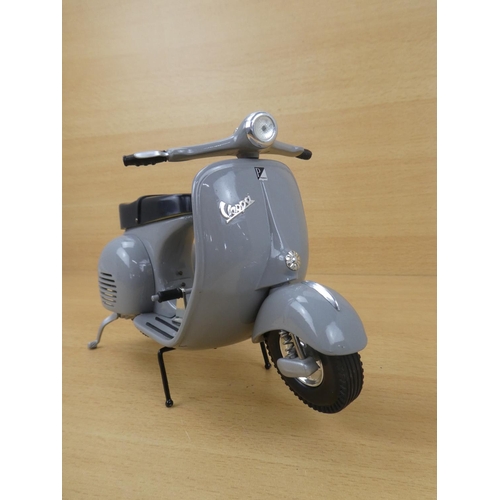 11 - A limited edition diecast Grey Vespa scooter, 1707/5000.