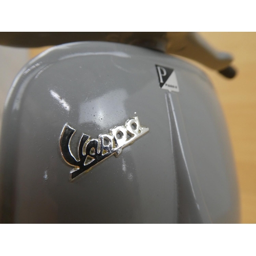 11 - A limited edition diecast Grey Vespa scooter, 1707/5000.