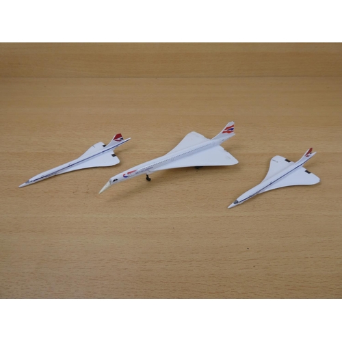 14 - A Corgi 'Concorde' plane and two others.