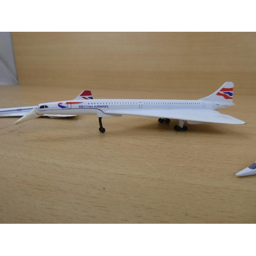 14 - A Corgi 'Concorde' plane and two others.