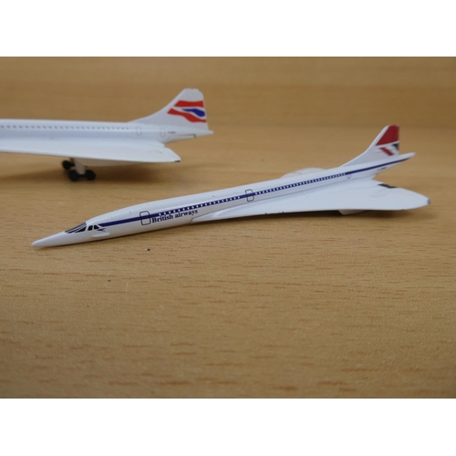 14 - A Corgi 'Concorde' plane and two others.