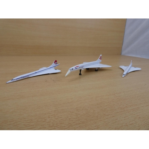 14 - A Corgi 'Concorde' plane and two others.