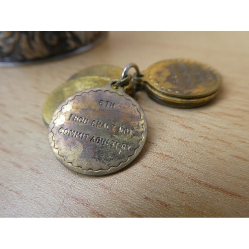 32 - A white metal trinket box and contents to include a Whiskey decanter label and more.