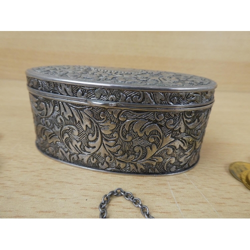 32 - A white metal trinket box and contents to include a Whiskey decanter label and more.