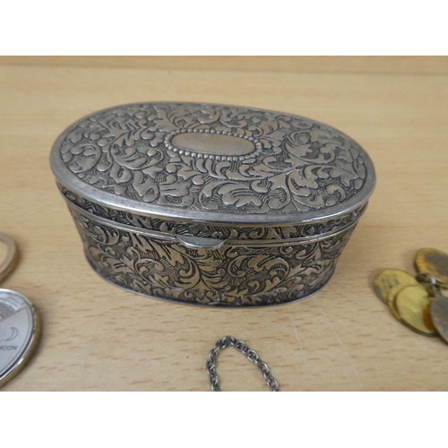 32 - A white metal trinket box and contents to include a Whiskey decanter label and more.