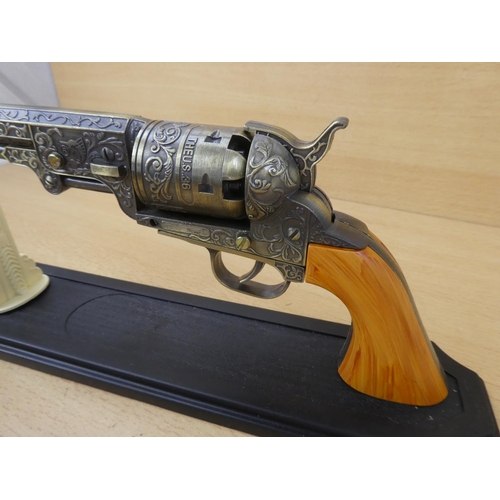 40 - A replica 'The US .36' colt revolver on stand.