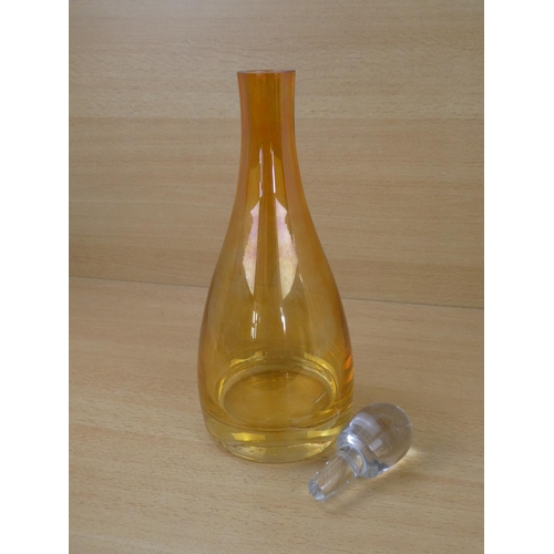 46 - A stunning coloured glass decanter and stopper.