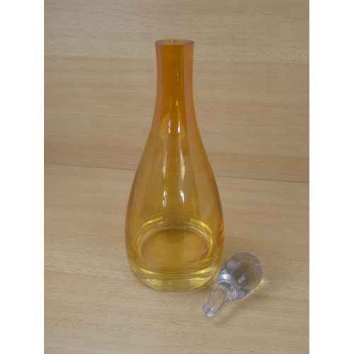 46 - A stunning coloured glass decanter and stopper.