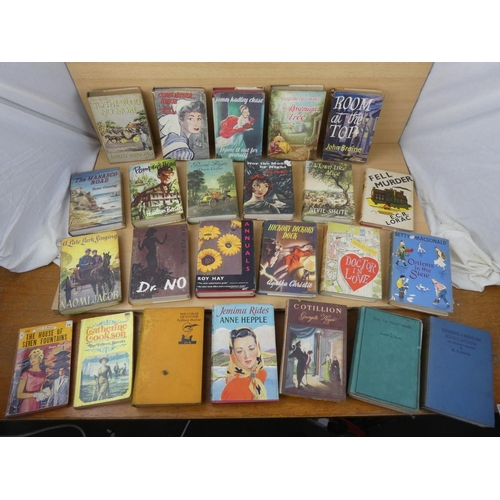 59 - A large assortment of vintage books to include 'A Town Like Alice' and more.