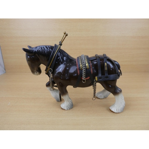 62 - A Clydesdale pottery horse and harness.