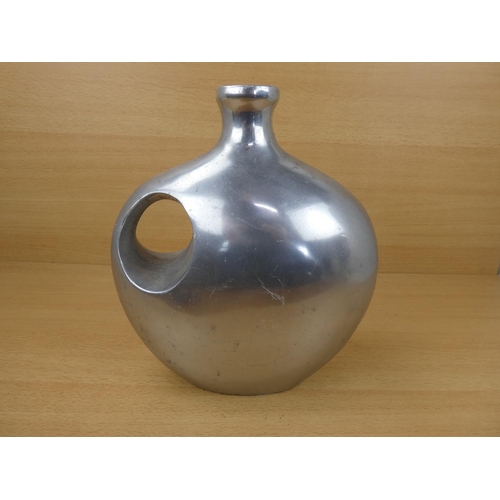 64 - A large metal Indian vase. 26x23cm.