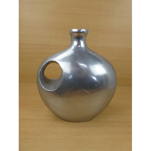 64 - A large metal Indian vase. 26x23cm.