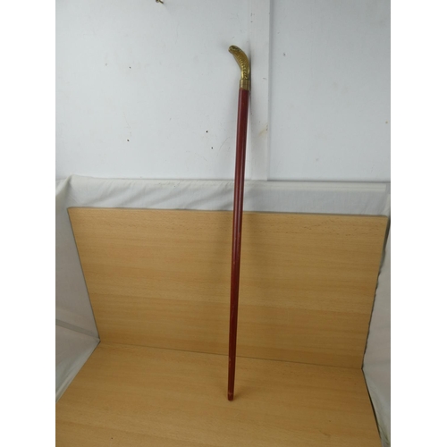 84 - A brass snake head walking stick.