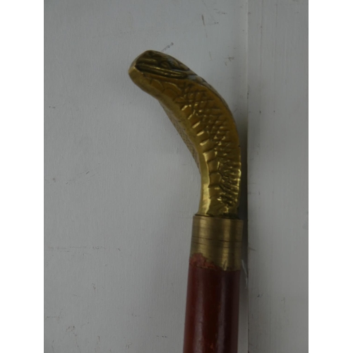 84 - A brass snake head walking stick.