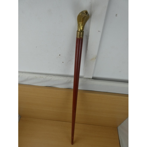 84 - A brass snake head walking stick.