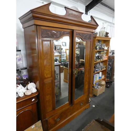 87 - A stunning antique mahogany and walnut two door wardrobe with mirror panels, measuring 150x230x52cm.