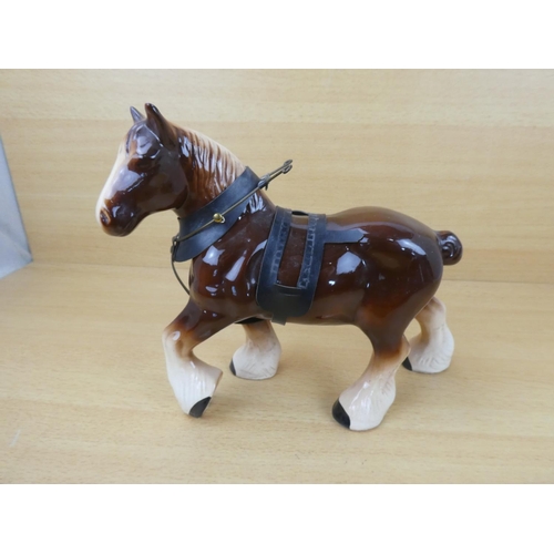 97 - A ceramic Clydesdale horse.