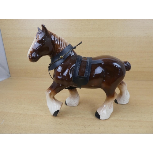 97 - A ceramic Clydesdale horse.