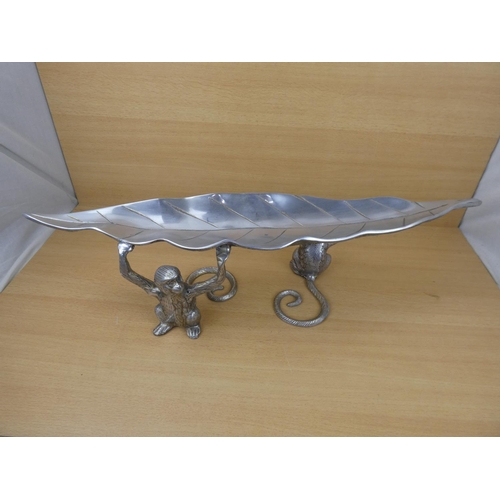 99 - An unusual metal centre piece, measuring 70cm in length.