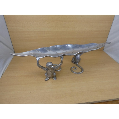 99 - An unusual metal centre piece, measuring 70cm in length.