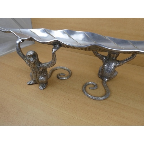 99 - An unusual metal centre piece, measuring 70cm in length.