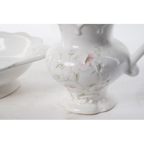 104 - A jug and bowl set with floral design.