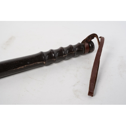 106 - A vintage wooden police truncheon.