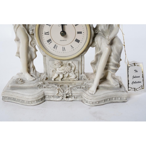 108 - A Juliana Collection figurine mantle clock.