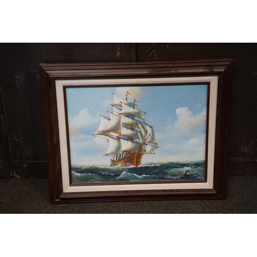 140 - A framed oil print of a sailing ship, measuring 40x30cm.