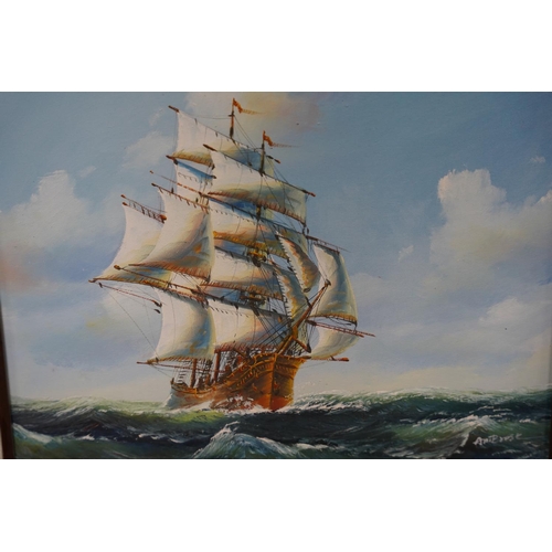 140 - A framed oil print of a sailing ship, measuring 40x30cm.