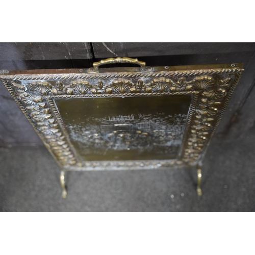 141 - A vintage brass firescreen, measuring 46x68cm.