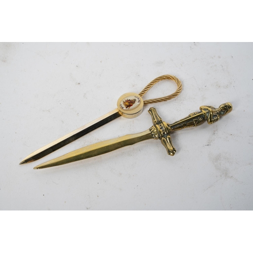 148 - A brass letter opener and another.