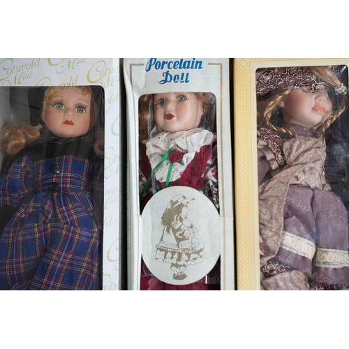 486 - A lot of four boxed porcelain faced collectors dolls.