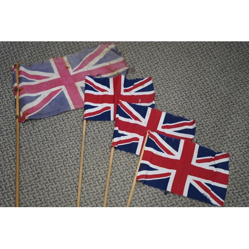 493 - Three vintage British made union jack flags and another.