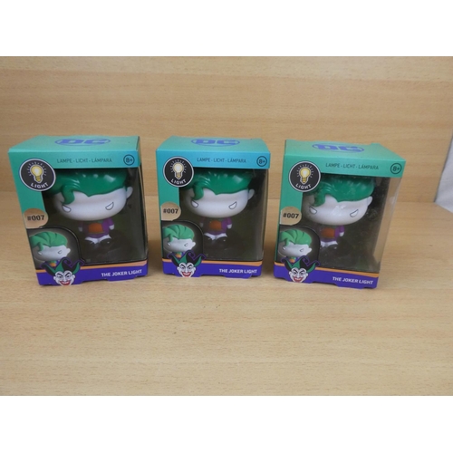 501 - Three boxed DC Joker lights.