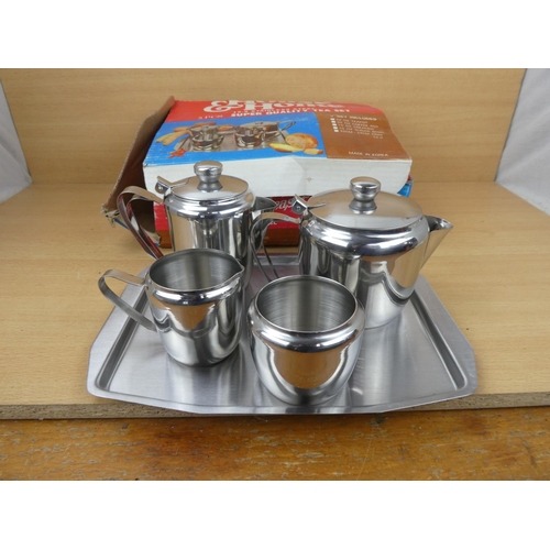 508 - A vintage boxed House & Home stainless tea set.