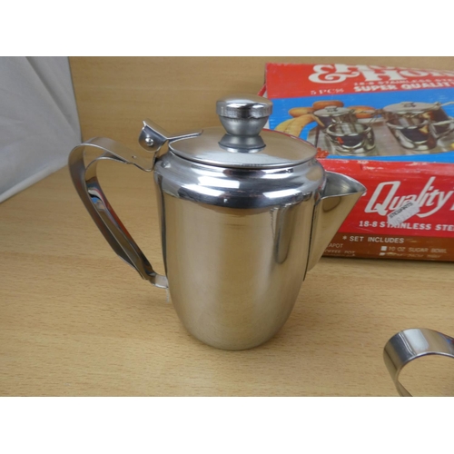 508 - A vintage boxed House & Home stainless tea set.