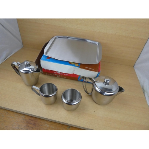 508 - A vintage boxed House & Home stainless tea set.