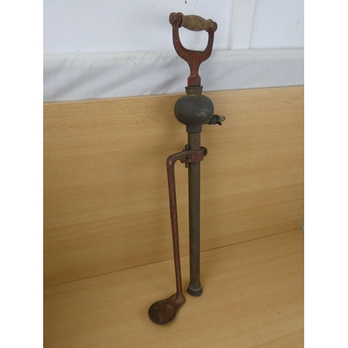 513 - An antique Prima foot pump.