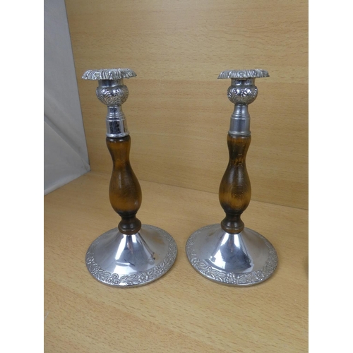 523 - A pair of metal and wood turned candlesticks and another pair.